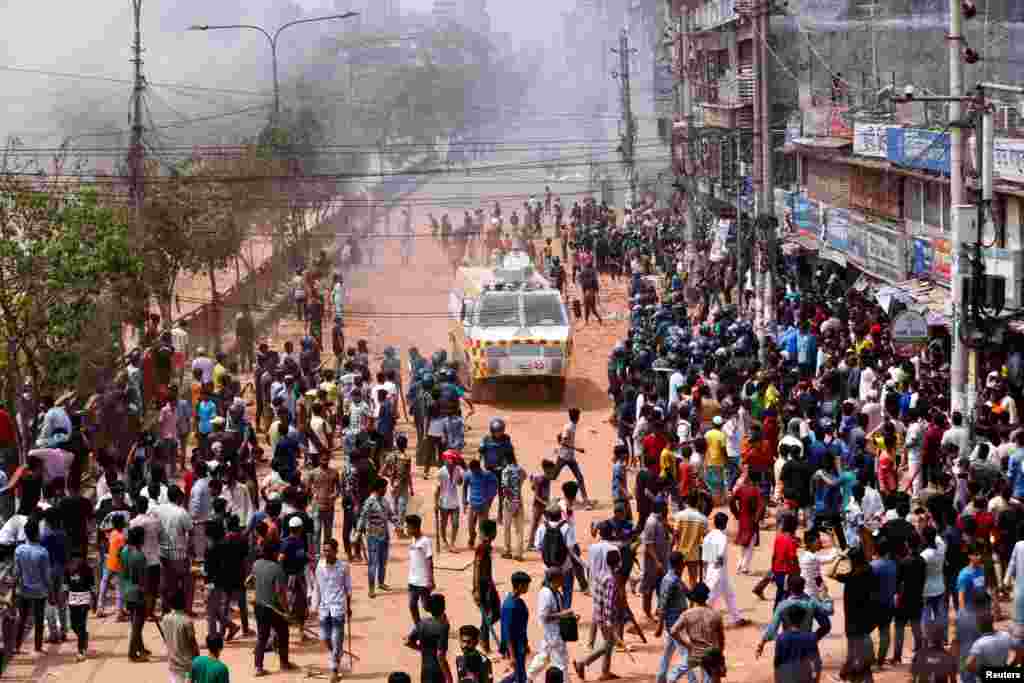 Students of the Dhaka College engage in clashes with workers of the New Market shops in Dhaka, Bangladesh.