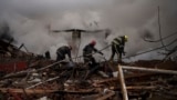 Firefighters work to extinguish a fire after a Russian attack destroyed the building of a culinary school in Kharkiv, Ukraine.