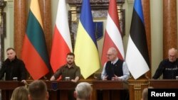 Ukrainian President Volodymyr Zelenskiy attends a joint news briefing with Polish President Andrzej Duda, Latvian President Egils Levits, Estonian President Alar Karis and Lithuanian President Gitanas Nauseda (not pictured) in Kyiv, Apr. 13, 2022.