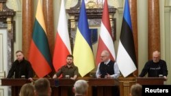 Ukrainian President Volodymyr Zelenskiy attends a joint news briefing with Polish President Andrzej Duda, Latvian President Egils Levits, Estonian President Alar Karis and Lithuanian President Gitanas Nauseda (not pictured) in Kyiv, April 13, 2022.