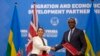 Britain's Home Secretary Priti Patel, (L) shakes hands with Rwanda's Minister of Foreign Affairs Vincent Biruta, (R) after signing the immigration deal in Kigali, Rwanda Thursday, April 14, 2022.