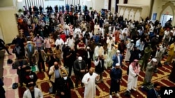 FILE - Worshippers perform an Eid al-Fitr prayer at the Masjidullah Mosque in Philadelphia, May 13, 2021. This year, in a rare convergence, In a rare convergence, April bears significance for Jews, Western Christians, Muslims, Buddhists, Baha'is, Sikhs, Jains and Hindus.
