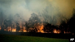 A bushfire burns in Bodalla, New South Wales, Australia, Jan. 25, 2020. 