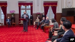 In this photo released by Taiwan's Presidential Office, U.S. Senator Richard Burr, left, speaks during a meeting with Taiwan's President Tsai Ing-wen, at the Presidential Office in Taipei, Taiwan, April 15, 2022.