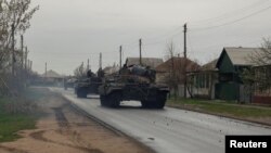 Tanks of Ukrainian Armed Forces ride along a street in a village, as Russia's attack on Ukraine continues, in Donetsk Region, Ukraine, Apr. 18, 2022. 