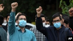 On April 18, 2022, protesters demonstrate near the Swedish Embassy in Tehran, Iran, to condemn a right-wing group's plan to burn the Quran.