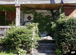 A boarded-up home in East Cleveland, Ohio, Sept. 24, 2014, one of the Midwest states hardest hit by the foreclosure crisis that began several years before the housing bubble fully burst in late 2007.