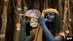 A student takes part in Tamil New Year and Vishu celebrations in Chennai, India.