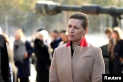 FILE - Denmark's Prime Minister Mette Frederiksen visits NATO's enhanced Forward Presence battle group troops in Adazi, Latvia, March 31, 2022.