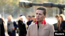 FILE - Denmark's Prime Minister Mette Frederiksen visits NATO's enhanced Forward Presence battle group troops in Adazi, Latvia, March 31, 2022.