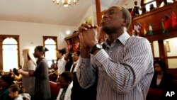 File - Congregants At The Historic Black Church Pentecostal Tabernacle Pray During A Service In Cambridge, Mass., February 27, 2011.