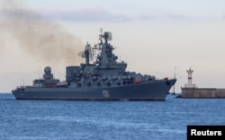 FILE - The now sunk Russian navy guided missile cruiser Moskva is seen sailing back into a harbor in the port of Sevastopol, in Russia-annexed Crimea, Nov. 16, 2021.