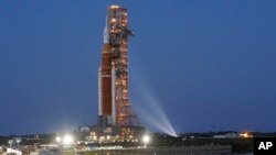 FILE - The NASA Artemis rocket with the Orion spacecraft aboard leaves the Vehicle Assembly Building moving slowly on an 11-hour journey to pad 39B at the Kennedy Space Center in Cape Canaveral, Fla., March 17, 2022.