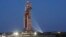 FILE - The NASA Artemis rocket with the Orion spacecraft aboard leaves the Vehicle Assembly Building moving slowly on an 11-hour journey to pad 39B at the Kennedy Space Center in Cape Canaveral, Fla., March 17, 2022.