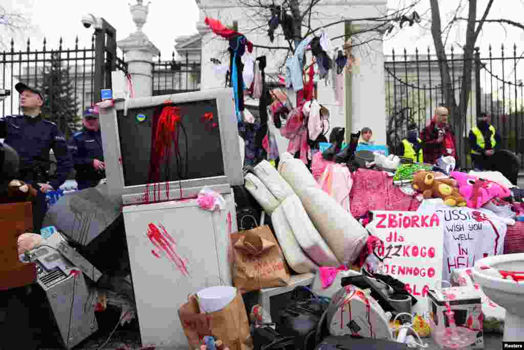 People take part in an anti-Russian demonstration outside the Russian Embassy in Warsaw, Poland, amid Russia&#39;s invasion of Ukraine.