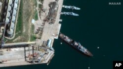 This satellite image provided by Maxar Technologies shows cruiser Moskva in port Sevastopol in Crimea, Apr. 7, 2022. (Satellite image ©2022 Maxar Technologies via AP)