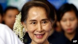 FILE - In this Dec. 14, 2018, file photo, ousted Myanmar leader Aung San Suu Kyi arrives to attend the Myanmar Entrepreneurship Summit at the Myanmar International Convention Center in Naypyidaw, Myanmar.