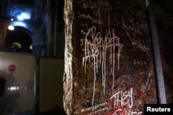 The decorated frontal of the Crusader-era high altar is seen covered in graffiti after it was recently turned over during renovations.