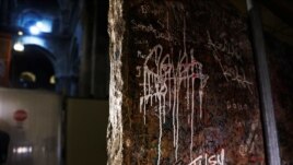 The decorated frontal of the Crusader-era high altar is seen covered in graffiti after it was recently turned over during renovations.