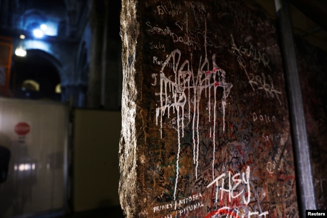 The decorated frontal of the Crusader-era high altar is seen covered in graffiti after it was recently turned over during renovations.