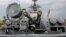 FILE - Russia's coat of arms, the double headed eagle, is seen on covers of the missile cruiser Moskva in the Ukrainian Black Sea port of Sevastopol, Sept. 16, 2008.