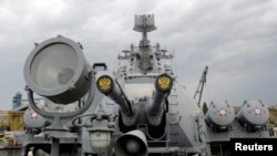FILE - FILE PHOTO: Russia's coat of arms, the double headed eagle, is seen on covers of the missile cruiser Moskva in the Ukrainian Black Sea port of Sevastopol, Sept. 16, 2008.