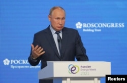 Russian President Vladimir Putin delivers a speech during a plenary session of the Russian Energy Week International Forum in Moscow, Russia October 13, 2021. Sergei Ilnitsky/Pool via REUTERS