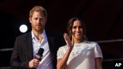 Le prince Harry et son épouse Meghan prennent la parole lors du festival Global Citizen, le 25 septembre 2021 à New York.