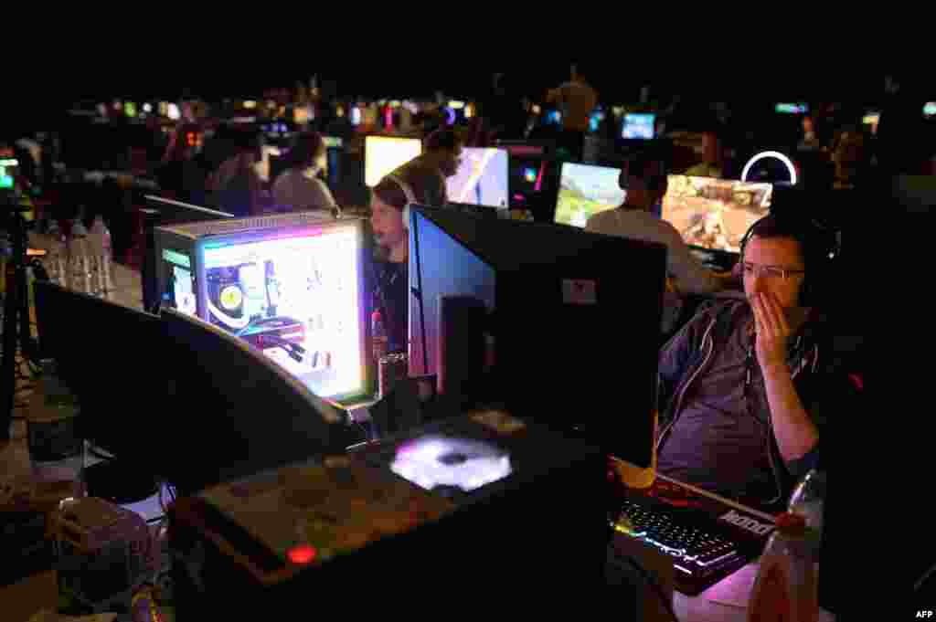 Members of the gaming community compete during the four-day Insomnia Gaming Festival at the NEC in Birmingham, central England.&nbsp;The festival is set to attract 40,000 visitors and will host the UK&#39;s largest LAN (Local Area Network) competitions in their Bring Your Own Computer area where 2,800 gamers will be able to enjoy non-stop, 24-hour gaming.&nbsp;