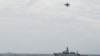 FILE - An Indonesian Airforce F-16 Jet Fighter flies over Indonesian navy warship during an operation in Natuna, near the South China Sea, Indonesia, Jan. 10, 2020 in this photo taken by Antara Foto.