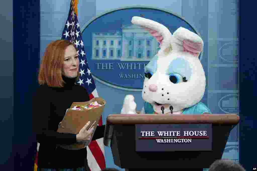An Easter Bunny joins White House press secretary Jen Psaki at the beginning of the daily briefing at the White House in Washington, April 18, 2022.