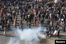 Farmers protest against the newly passed farm bills at Singhu border near Delhi, India, Nov. 27, 2020.