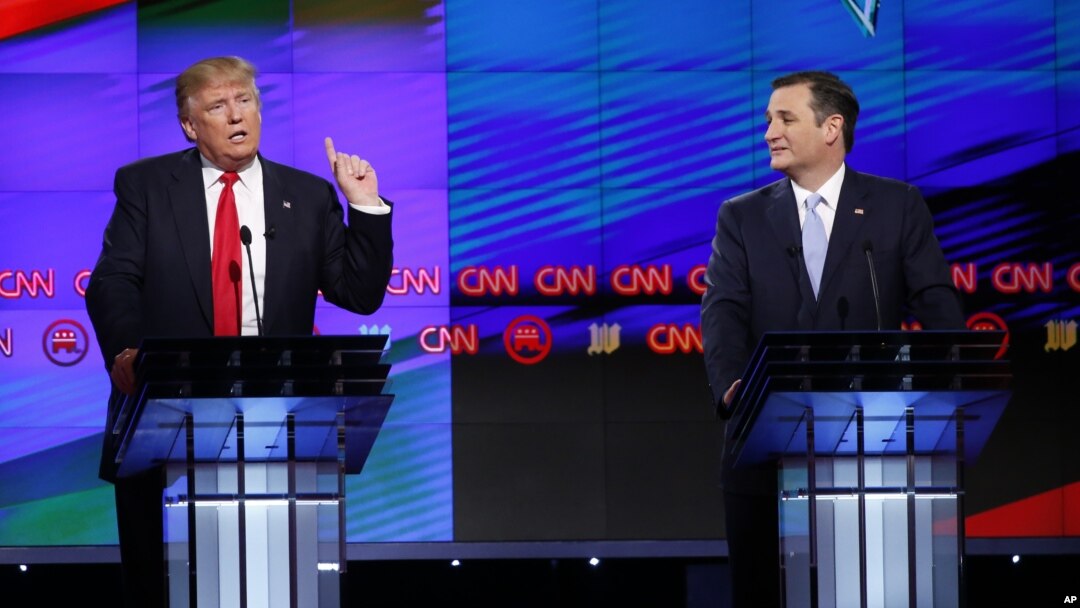 Republican presidential candidate, businessman Donald Trump speaks, as Republican presidential candidate, Sen. Ted Cruz, R-Texas, listens, during the Republican presidential debate, March 10, 2016.