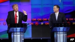 Republican presidential candidate, businessman Donald Trump speaks, as Republican presidential candidate, Sen. Ted Cruz, R-Texas, listens, during the Republican presidential debate, March 10, 2016.