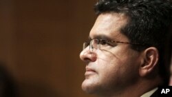 FILE - In this Sept. 29, 2015 file photo, Resident Commissioner Pedro Pierluisi, D-P.R., testifies before the Senate Finance Committee hearing on Puerto Rico's current economic conditions and long-term fiscal health, in Washington. 