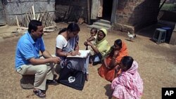 Census officials collect details from village women during first phase of the census at Hatkhuwapara Village, near the northeastern Indian city of Guwahati, India (File)