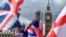National flags flutter near the The Elizabeth Tower, commonly referred to as Big Ben, in central London, June 9, 2017. 