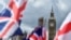 British national flags flutter near the The Elizabeth Tower, commonly referred to as Big Ben, in central London. 