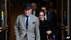 Roger Stone with his wife Nydia Stone, right, leave federal court Washington, Nov. 12, 2019. 