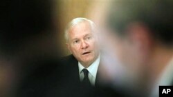 Defense Secretary Robert Gates speaks to reporters in Cairo, Mar 23 2011