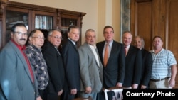 U.S. Senators Tim Kaine and Mark Warner, Democrats from Virginia, pose with seven Virginia tribal chiefs ahead of final passage of bill granting recognition to six Virginia Indian tribes, January 11, 2017. President Donald Trump signed the new law Januar