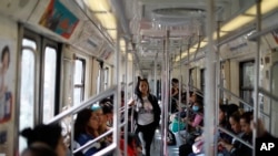 Commuters ride in a subway car in the section dedicated to women and children under 12, in Mexico City, March 5, 2020. After a year of numerous protests against gender violence in Mexico, women are calling for a general strike on March 9. 