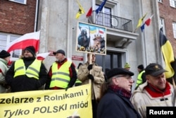 Polish farmers protest over price pressures, taxes and green regulation, grievances shared by farmers across Europe, and against the import of agricultural produce and food products from Ukraine, in Gdansk, Poland, Feb. 20, 2024.