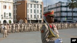 A Libyan Army commander leads a parade to celebrate the 75th anniversary of the establishment of the Libyan Army in Martyrs Square, Tripoli, Aug 13, 2015.