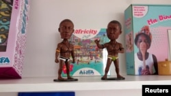 Figurines representing Senegalese wrestlers, manufactured by Rocky Daffe, are displayed at Alyfa Toys' headquarters in Dakar, Senegal, December 17, 2024.