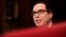 FILE - Treasury Secretary Steven Mnuchin testifies on Capitol Hill in Washington, July 26, 2017, before the Senate Appropriations subcommittee on the fiscal 2018 federal budget. 
