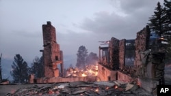 The remains of a home left after a wildfire spread through the Village of Ruidoso, New Mexico, April 13, 2022.