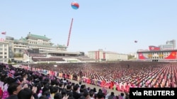 A view of a national meeting and public procession to mark the 110th birth anniversary of the state's founder, Kim II Sung, in Pyongyang, North Korea, April 15, 2022. 