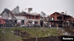 Firefighters work at the site of military strikes on buildings as Russia's attack on Ukraine continues, in Lviv, Ukraine April 18, 2022.