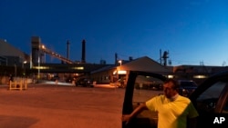 Tom Becker leaves after an overnight shift at a paper mill in Combined Locks, Wisconsin, Aug. 18, 2020. Between 2001 and 2016, the state's paper industry lost 15,000 jobs.